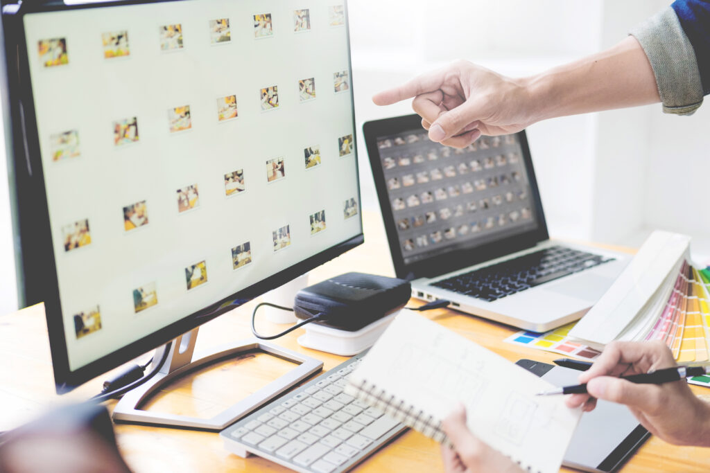 Design team at Social Feenix collaborating using Canva Affinity suite for professional branding and content creation.